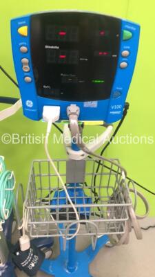 1 x Fukuda Denshi DS-7100 Monitor on Stand with ECG, SpO2 and BP Leads and 1 x GE Carescape V100 Dinamap Monitor on Stand with SpO2 and BP Leads (Both Power Up) - 2