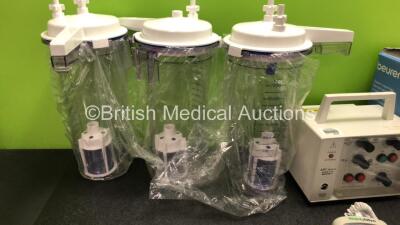 Mixed Lot Including 3 x Suction Cups with Lids, 1 x APC Medical 4170 Bedside External Pulse Generator, 1 x Beurer Medical Steam Vaporizer, 1 x N20 Hose and 1 x Welch Allyn Suretemp Plus Thermometer (Damaged Screen-See Photo) - 2