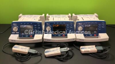 Job Lot Including 2 x Philips Heartstart XL Smart Biphasic Defibrillator Including ECG and Printer Options, 1 x Agilent Heartstream XL Smart Biphasic Defibrillator Including ECG and Printer Options with 3 x Paddle Leads and 3 x Philips M3725A Test Loads (