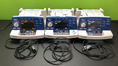 Job Lot Including 2 x Philips Heartstart XL Smart Biphasic Defibrillator Including ECG and Printer Options, 1 x Philips Heartstart XL Smart Biphasic Defibrillator Including Pacer, ECG and Printer Options with 3 x Paddle Leads (All Power Up) *SN US00127044