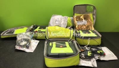 4 x Zoll AED Pro Defibrillators with 4 x Zoll AED Battery Packs, 4 x Electrode Pads and 3 x 3 Lead ECG Leads in Carry Bags (All Power Up) *SN AA13C027912, AA09C013198, AA13C027889, AA13C027938*