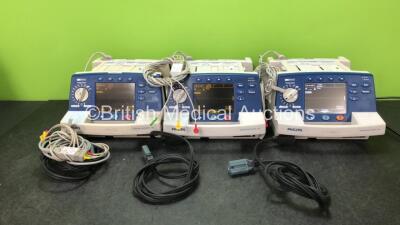 3 x Philips Heartstart XL Defibrillators Including ECG and Printer Options with 3 x 3 Lead ECG Leads and 3 x Paddle Leads (All Power Up)