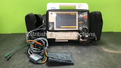 Medtronic Physio Control Lifepak 12 Biphasic Defibrillator / Monitor Including ECG, SpO2, NIBP and Printer Options with 1 x 4 Lead ECG Lead, 1 x NIBP Hose, 1 x BP Cuff, 2 x Batteries and Carry Bag (Powers Up with Damaged Cover-See Photo)