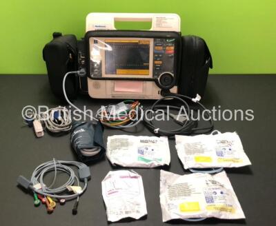 Medtronic Lifepak 12 Biphasic Defibrillator / Monitor Including ECG, NIBP, SpO2 and Printer Options with 1x 4 Lead ECG Lead, 1 x 6 Lead ECG Lead, 1 x Paddle Lead, 1 x SpO2 Finger Sensor, 1 x BP Cuff with Hose, 3 x Electrode Packs *All Expired* and 1 x Pul