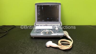 GE Voluson-i BT14 Portable Ultrasound Scanner *Mfd - 03/2004* Software Version - CC200 with 1 x 4C-RS Ultrasound Transducer / Probe *Mfd - 03/2017* (Powers Up with Stock Power Supply, Power Supply Not Included, Slight Damage to Casing - See Photo) *B05047