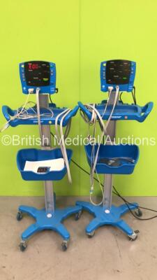 2 x GE Dinamap Carescape V100 Vital Signs Monitors on Stands with SPO2 Finger Sensors, BP Hoses and Cuffs (Both Power Up)