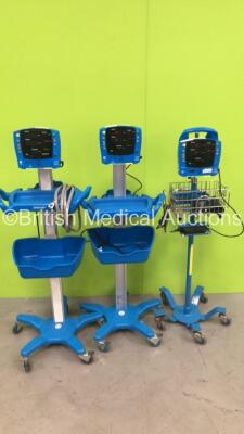 2 x GE Carescape V100 Vital Signs Monitor on Stand and 1 x GE ProCare V100 Vital Signs Monitor on Stand (All Power Up) *S/N SH619050727SA / SH615118643SA / AAW04330002SA*