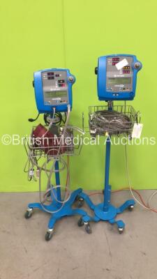 2 x GE Dinamap 300V2 Vital Signs Monitors on Stands with SPO2 Finger Sensors, BP Hoses and Cuffs (Both Power Up)