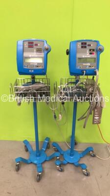 2 x GE Dinamap 300V2 Vital Signs Monitors on Stands with SPO2 Finger Sensors, BP Hoses and Cuffs (Both Power Up)