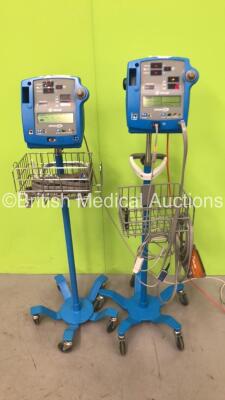 2 x GE Dinamap Pro 400 Vital Signs Monitors on Stands with SPO2 Finger Sensors, BP Hoses and Cuffs (Powers Up)