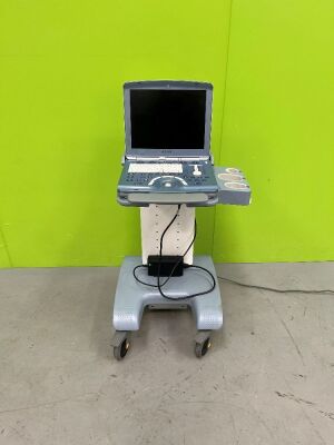 GE Voluson e Portable Ultrasound Scanner *S/N B52215* **Mfd 12/2008** on Voluson Dock Cart (HDD REMOVED, Dock Cart Powers Up, No Power to Ultrasound, Damaged Handle on Cart)