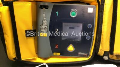 2 x Laerdal Heartstart FR2 Defibrillators in Carry Bags with 3 x Philips M3863A Batteries and 5 x Electrode Packs *3 x Expired* (Both Power Up and Pass Self Tests) **SN 1002073519 / 1002073515** - 4