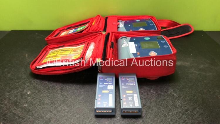 2 x Laerdal Heartstart FR2+ Defibrillators with 4 x Philips M3863A Batteries *Install Dates 07-2021, 11-2023, 12-2015, 04-2020* In 2 x Carry Bags (Both Power Up and Pass Self Tests) *SN 0307227573, 0207226092*