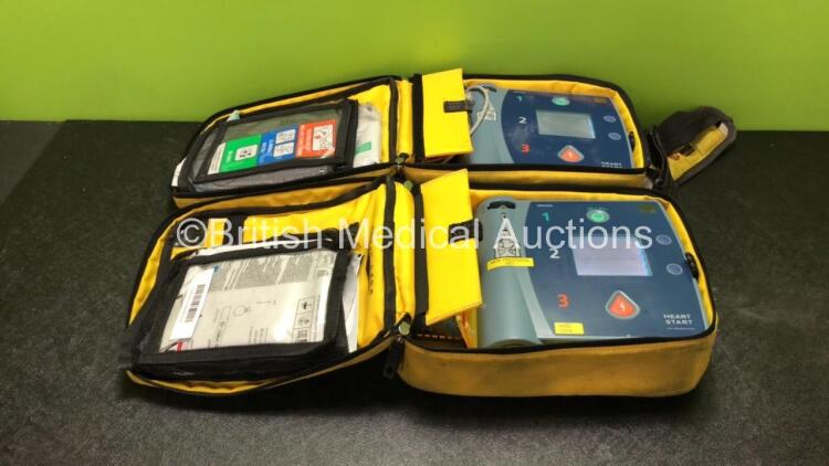 2 x Philips Heartstart FR2+ Defibrillators with 2 x Philips M3863A Batteries *Install Dates 05-2020, 08-2020* In 2 x Carry Bags (Both Power Up and Pass Self Tests) *SN 1110990929, 1011890751*