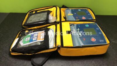 2 x Philips Heartstart FR2+ Defibrillators with 2 x Philips M3863A Batteries *Install Dates 02-2022, 08-2020* In 2 x Carry Bags (Both Power Up and Pass Self Tests) *SN 0606196204, 0610990082