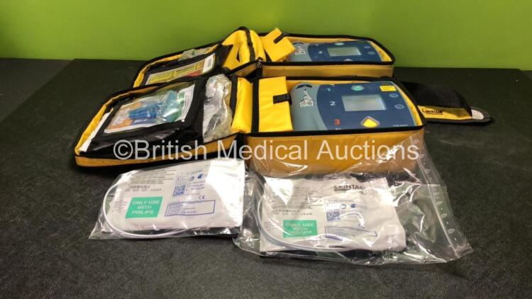 2 x Laerdal Heartstart FR2+ Defibrillators with 2 x Philips M3863A Batteries *Install Dates 11-2023, 07-2024* 2 x Defibrillator Electrodes *Both In Date* In 2 x Carry Bags (Both Power Up and Pass Self Tests) *SN 0510801551, 1007258821*