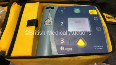 2 x Laerdal Heartstart FR2+ Defibrillators with 2 x Philips M3863A Batteries *Install Dates 11-2023, 07-2024* 2 x Defibrillator Electrodes *Both In Date* In 2 x Carry Bags (Both Power Up and Pass Self Tests) *SN 0510801551, 1007258821* - 2