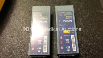 2 x Laerdal Heartstart FR2+ Defibrillators with 2 x Philips M3863A Batteries *Install Dates 11-2023, 07-2024* 2 x Defibrillator Electrodes *Both In Date* In 2 x Carry Bags (Both Power Up and Pass Self Tests) *SN 0510801551, 1007258821* - 5