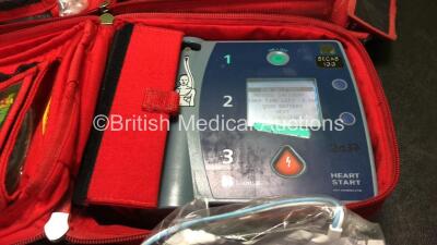 2 x Laerdal Heartstart FR2+ Defibrillators with 2 x Philips M3863A Batteries *Install Dates 09-2025, 12-2024* 2 x Defibrillator Electrodes *1 In Date, 1 Expired* In 2 x Carry Bags (Both Power Up and Pass Self Tests) *SN 0207225750, 0307227407* - 3