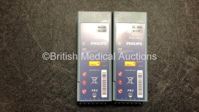 2 x Laerdal Heartstart FR2+ Defibrillators with 2 x Philips M3863A Batteries *Install Dates 09-2025, 12-2024* 2 x Defibrillator Electrodes *1 In Date, 1 Expired* In 2 x Carry Bags (Both Power Up and Pass Self Tests) *SN 0207225750, 0307227407* - 5