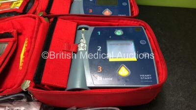 2 x Laerdal Heartstart FR2+ Defibrillators with 2 x Philips M3863A Batteries *Install Dates 09-2026, 02-2021* 2 x Defibrillator Electrodes *Both Out of Date* In 2 x Carry Bags (Both Power Up and Pass Self Tests) *SN 1207266842, 0207224837* - 2