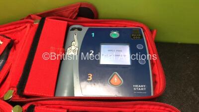 2 x Laerdal Heartstart FR2+ Defibrillators with 2 x Philips M3863A Batteries *Install Dates 09-2026, 02-2021* 2 x Defibrillator Electrodes *Both Out of Date* In 2 x Carry Bags (Both Power Up and Pass Self Tests) *SN 1207266842, 0207224837* - 3