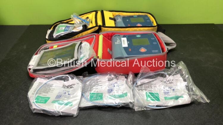 2 x Philips Heartstart FR2+ Defibrillators with 2 x Philips M3863A Batteries *Install Dates 05-2020, 01-2023 * 3 x Defibrillator Electrodes *All Out of Date* In 2 x Carry Bags (Both Power Up and Pass Self Tests) *SN 1110990372, 0905166713