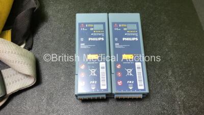 2 x Philips Heartstart FR2+ Defibrillators with 2 x Philips M3863A Batteries *Install Dates 05-2020, 01-2023 * 3 x Defibrillator Electrodes *All Out of Date* In 2 x Carry Bags (Both Power Up and Pass Self Tests) *SN 1110990372, 0905166713 - 5