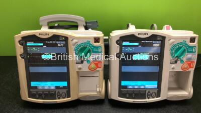 2 x Philips Heartstart MRx Defibrillators Including Pacer, ECG and Printer Options with 1 x Paddle Lead (Both Power Up with Stock Power Module, Module Not Included, 1 x Missing Printer, 1 x Missing Handle - See Photos) - 2