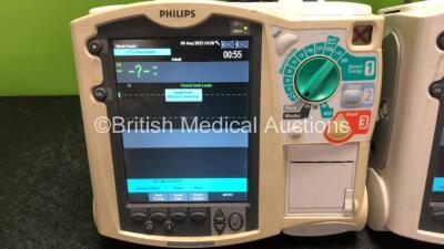 2 x Philips Heartstart MRx Defibrillators Including Pacer, ECG and Printer Options with 1 x Paddle Lead (Both Power Up with Stock Power Module, Module Not Included, 1 x Missing Printer, 1 x Missing Handle - See Photos) - 3