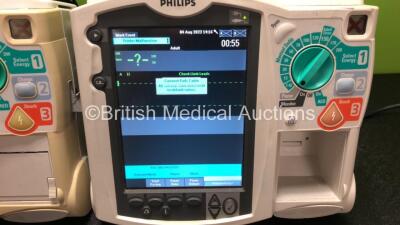 2 x Philips Heartstart MRx Defibrillators Including Pacer, ECG and Printer Options with 1 x Paddle Lead (Both Power Up with Stock Power Module, Module Not Included, 1 x Missing Printer, 1 x Missing Handle - See Photos) - 4