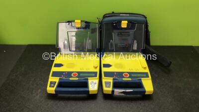 2 x Cardiac Science Powerheart AED G3 Automated External Defibrillators with 2 x Cardiac Science Ref 9146-302 Batteries in 1 x Carry Case (Both Power Up, 1 with Service Required Message) *SN 4403858, 4412680*