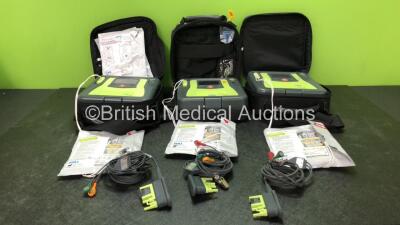 3 x Zoll AED PRO Defibrillators with 3 x 3 Lead ECG Leads, 5 x Defibrillator Pads *All Out of Date* 3 x Batteries in 3 x Carry Bags (All Power Up) *SN AA13C027913, AA06D002403, AA13C027770*