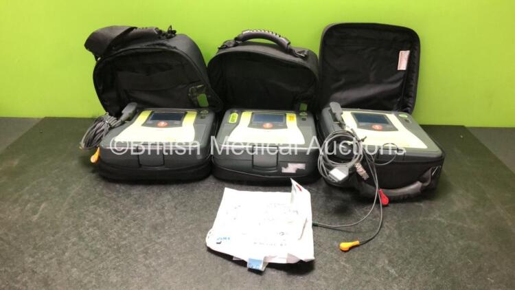 3 x Zoll AED PRO Defibrillators with 1 x 3 Lead ECG Leads, 1 x Defibrillator Pads *In Date* 3 x Batteries in 3 x Carry Bags (All Power Up) *SN AA08H011345, AA13C027857, AA09B013084