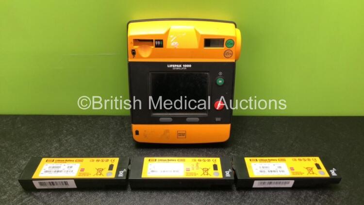 Physio Control Lifepak 1000 Defibrillator with 4 x Physio Control Ref 11141-000156 Batteries *1 x Good Battery, 3 x Flat Batteries* (Powers Up)