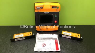 Physio Control Lifepak 1000 Defibrillator with 3 x Physio Control Ref 11141-000156 Batteries *1 x Low Battery, 2 x Flat Batteries* and 1 x Electrode Pack *Expired* (Powers Up with Damage to Casing - See Photos)