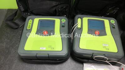 3 x Zoll AED PRO Defibrillators with 3 x Batteries with 3 x 3 Lead ECG Leads, 2 x Defibrillator Pads *1 In Date, 1 Expired* In 3 x Carry Bags (All Power Up) *SN AA11B019771, AA10C016628, AA13B027600* - 2