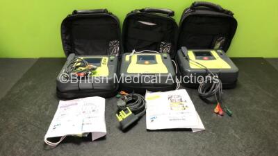 3 x Zoll AED PRO Defibrillators with 3 x Batteries with 3 x 3 Lead ECG Leads, 2 x Defibrillator Pads *Both Out of Date* In 3 x Carry Bags (All Power Up) *SN AA09C013183, AA05C000332, AA08009973*