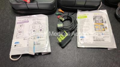 3 x Zoll AED PRO Defibrillators with 3 x Batteries with 3 x 3 Lead ECG Leads, 2 x Defibrillator Pads *Both Out of Date* In 3 x Carry Bags (All Power Up) *SN AA09C013183, AA05C000332, AA08009973* - 3