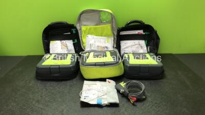 3 x Zoll AED PRO Defibrillators with 3 x Batteries with 1 x 3 Lead ECG Lead, 4 x Defibrillator Pads *All Out of Date* In 3 x Carry Bags (All Power Up) *SN AA14H033202, AA07EOO5946, AA13C027915*