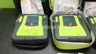 3 x Zoll AED PRO Defibrillators with 3 x Batteries with 1 x 3 Lead ECG Lead, 4 x Defibrillator Pads *All Out of Date* In 3 x Carry Bags (All Power Up) *SN AA14H033202, AA07EOO5946, AA13C027915* - 2