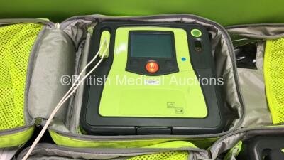 3 x Zoll AED PRO Defibrillators with 3 x Batteries with 3 x 3 Lead ECG Leads, 4 x Defibrillator Pads *3 Out of Date, 1 In Date* In 3 x Carry Bags (All Power Up) *SN AA09C013176, AA10L019420, AA10B016318* - 2
