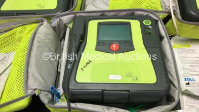 3 x Zoll AED PRO Defibrillators with 3 x Batteries with 3 x 3 Lead ECG Leads, 4 x Defibrillator Pads *3 Out of Date, 1 In Date* In 3 x Carry Bags (All Power Up) *SN AA09C013176, AA10L019420, AA10B016318* - 3