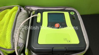 3 x Zoll AED PRO Defibrillators with 3 x Batteries with 3 x 3 Lead ECG Leads, 4 x Defibrillator Pads *3 Out of Date, 1 In Date* In 3 x Carry Bags (All Power Up) *SN AA09C013176, AA10L019420, AA10B016318* - 4