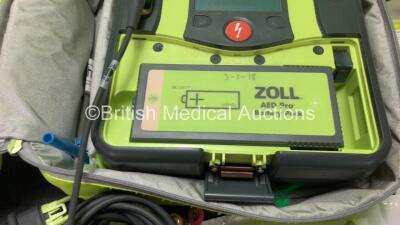 3 x Zoll AED PRO Defibrillators with 3 x Batteries with 3 x 3 Lead ECG Leads, 4 x Defibrillator Pads *3 Out of Date, 1 In Date* In 3 x Carry Bags (All Power Up) *SN AA09C013176, AA10L019420, AA10B016318* - 5