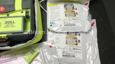 3 x Zoll AED PRO Defibrillators with 3 x Batteries with 3 x 3 Lead ECG Leads, 4 x Defibrillator Pads *3 Out of Date, 1 In Date* In 3 x Carry Bags (All Power Up) *SN AA09C013176, AA10L019420, AA10B016318* - 6