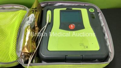 3 x Zoll AED PRO Defibrillators with 3 x Batteries with 2 x 3 Lead ECG Leads, 3 x Defibrillator Pads *All Out of Date* In 3 x Carry Bags (All Power Up) *SN AA10C016781, AA13C027734, AA11C020085* - 2