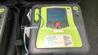 2 x Zoll AED PRO Defibrillators with 2 x 3 Lead ECG Leads, 2 x Electrode Packs *1 In Date, 1 Out of Date* in 2 x Carry Bags (Both Power Up with Stock Battery, Batteries Not Included, Slightly Damaged Display Screens) - 3