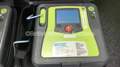 2 x Zoll AED PRO Defibrillators with 2 x 3 Lead ECG Leads, 3 x Electrode Packs *All Out of Date* in 2 x Carry Bags (Both Power Up with Stock Battery, Batteries Not Included, Slightly Damaged Display Screens) - 3