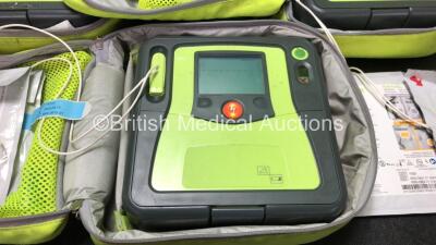 3 x Zoll AED PRO Defibrillators with 3 x Batteries, 2 x 3 Lead ECG Leads, 3 x Defibrillator Pads *2 In Date, 1 Out of Date* in 3 x Carry Bags (All Power Up) *SN AA10J019007, AA09L015646, AA06D002408* - 2